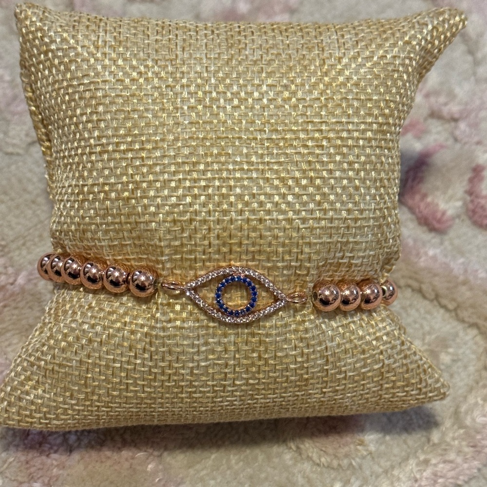 Evil eye rose tone pave stainless steel bracelet